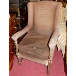 A joined oak and barley twist turned framed and further upholstered winged open armchair, width