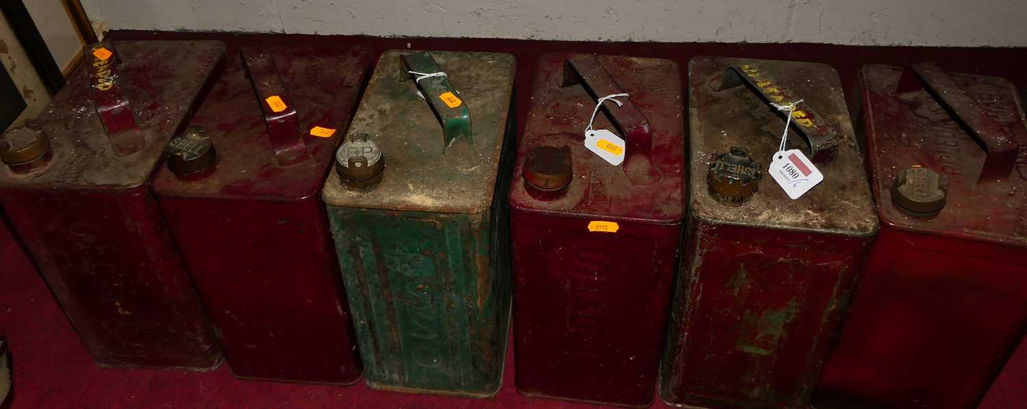 Six various painted metal fuel cans, to include ESSO and Shell examples