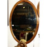 An Edwardian mahogany and chequer strung oval wall mirror, 78 x 54cm