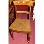 A set of eight Victorian mahogany panelled seat dining chairs, raised on turned forelegs