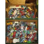 Two boxes of various heavily playworn diecast toy vehicles, to include examples by Corgi, Triang etc