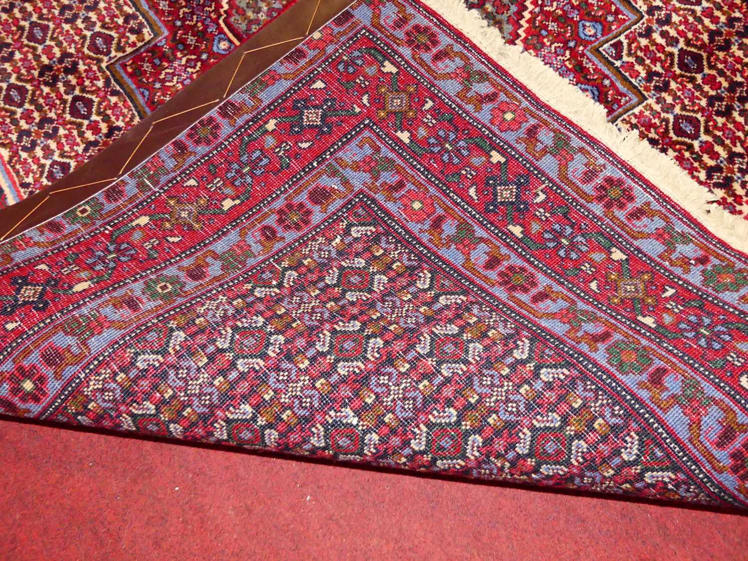 A Persian woollen red ground Senneh rug, 150 x 128cm - Image 5 of 5