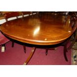 A reproduction mahogany Regency style D-end twin pedestal dining table, having single drop-in