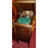 A 1930s 'His Master's Voice' oak freestanding gramophone, with hinged cover, w.45cm