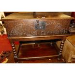 An 18th century line carved oak hinged top bible box, on later bobbin turned fixed stand, width