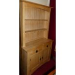 A contemporary beech kitchen dresser, having two-tier open shelf over twin frieze drawers, to twin