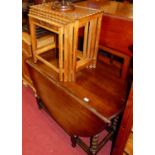 An oak barley twist drop leaf dining table, having a gateleg action, together with an Indian