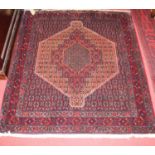 A Persian woollen red ground Senneh rug, 150 x 128cm