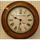 A circa 1900 oak circular dial clock, the white painted dial signed Mappin & Webb, with single