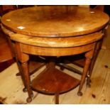 A 1930s figured walnut circular nest of five occasional tables, the largest dia.65cm