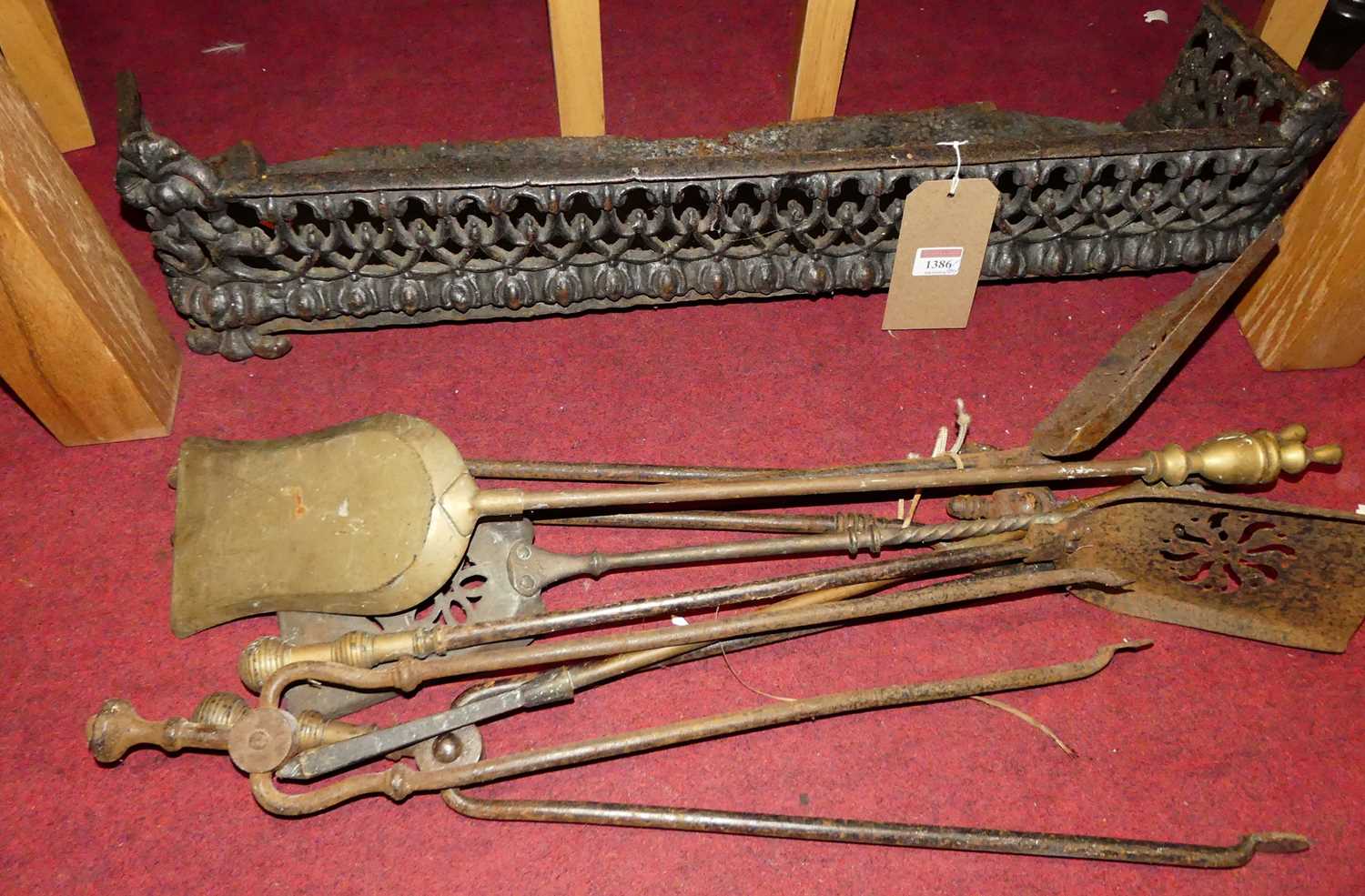Sundry 19th century fire tools, and a pierced fender