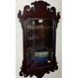 A circa 1900 mahogany fret carved bevelled rectangular wall mirror in the Chippendale taste, 76.5