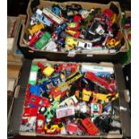 Two boxes containing a large quantity of playworn diecast model vehicles, examples by Matchbox,