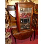 A George III mahogany dropleaf dining table, raised on padfeet; together with a 19th century