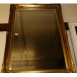 Reproduction gilt framed and bevelled rectangular wall mirror, 104x74cm