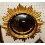 A 19th century gilt wood circular sunburst convex wall mirror, having beaded inner slip, dia. 55cm