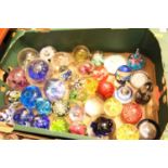 A box of mainly modern glass paperweights, to include Mdina example, signed verso and numbered 17