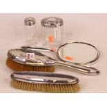 Two silver backed brushes; together with silver backed mirror and two silver topped dressing table