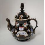 A Victorian barge ware teapot inscribed "Mrs H Warren, Ipswich 1881" height 30cm