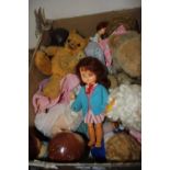 A box of vintage teddy bears and celluloid dolls