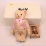 A Steiff limited edition Charlotte the Royal Baby bear, boxed; together with a Steiff Club miniature