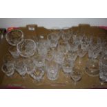 A box of various cut glass drinking glasses