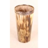A late Victorian horn beaker, having a silver monogrammed shield shaped cartouche and silver rim,