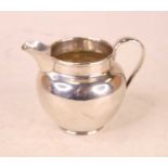 A George V silver cream jug, of plain undecorated form, 3.4oz