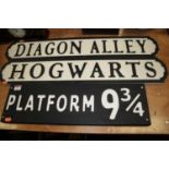 Two modern black and white painted street signs for Hogwarts and Diagon Alley, w.78cm; together with