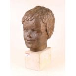 A 20th century plaster portrait head of a young boy, upon a veined white marble plinth, h.35cm