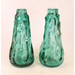 A pair of green tinted art glass vases, of tapered cylindrical form, having textured bark type