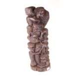 A large Makonde ebony 'tree of life' carving, typically carved as various entwined figures, h.56cm