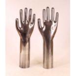 A pair of contemporary polished aluminium ring trees, each in the form of a hand, h.37cm