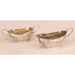 A pair of Edwardian silver open salts, each of half-gadrooned oval form with twin handles, 1.9oz