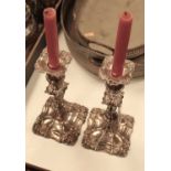 A pair of Old Sheffield Plate table candlesticks, each having a removable sconce to a knopped