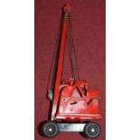 A Triang Toys tinplate four wheel crane finished in red