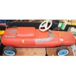 A plastic and metal framed children's ride-on car
