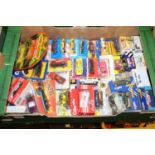 A quantity of carded and boxed modern issue diecast to include Hot Wheels, Matchbox, Siku, and