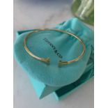 Tiffany T Gold Wire Bracelet T is for Tiffany and also for Tennis. Wear this 18-carat Tiffany wire