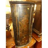 A 19th century chinoiserie black lacquered double door hanging bowfront corner cupboardCondition