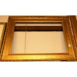 A late 19th century gilded oak and composition picture frame, rebate dimensions 64 x 91cm