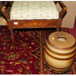 An Edwardian rosewood and upholstered hinge topped music stool, having end carry handles; together