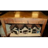 A 19th century stained pine rectangular farmhouse kitchen table, having single end drawer and raised