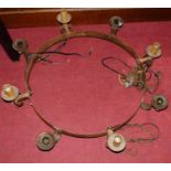 A Gothic style steel circular hanging eight-light electrolier, with ceiling rose and hanging chains,