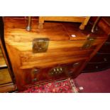 A contemporary Oriental teak side cabinet, with hinged upper compartment over twin lower cupboard