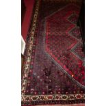 A Persian woollen Qashqai rug, 260 x 200cm