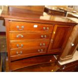 An Edwardian mahogany and inlaid music cabinet, having four drawers with hinged front panels, single