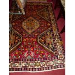 A Persian Tabriz woollen red ground rug, 225 x 155cm