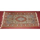 A small Persian woollen Tabriz hall rug, 122 x 58cm