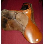 A tan leather horse saddle
